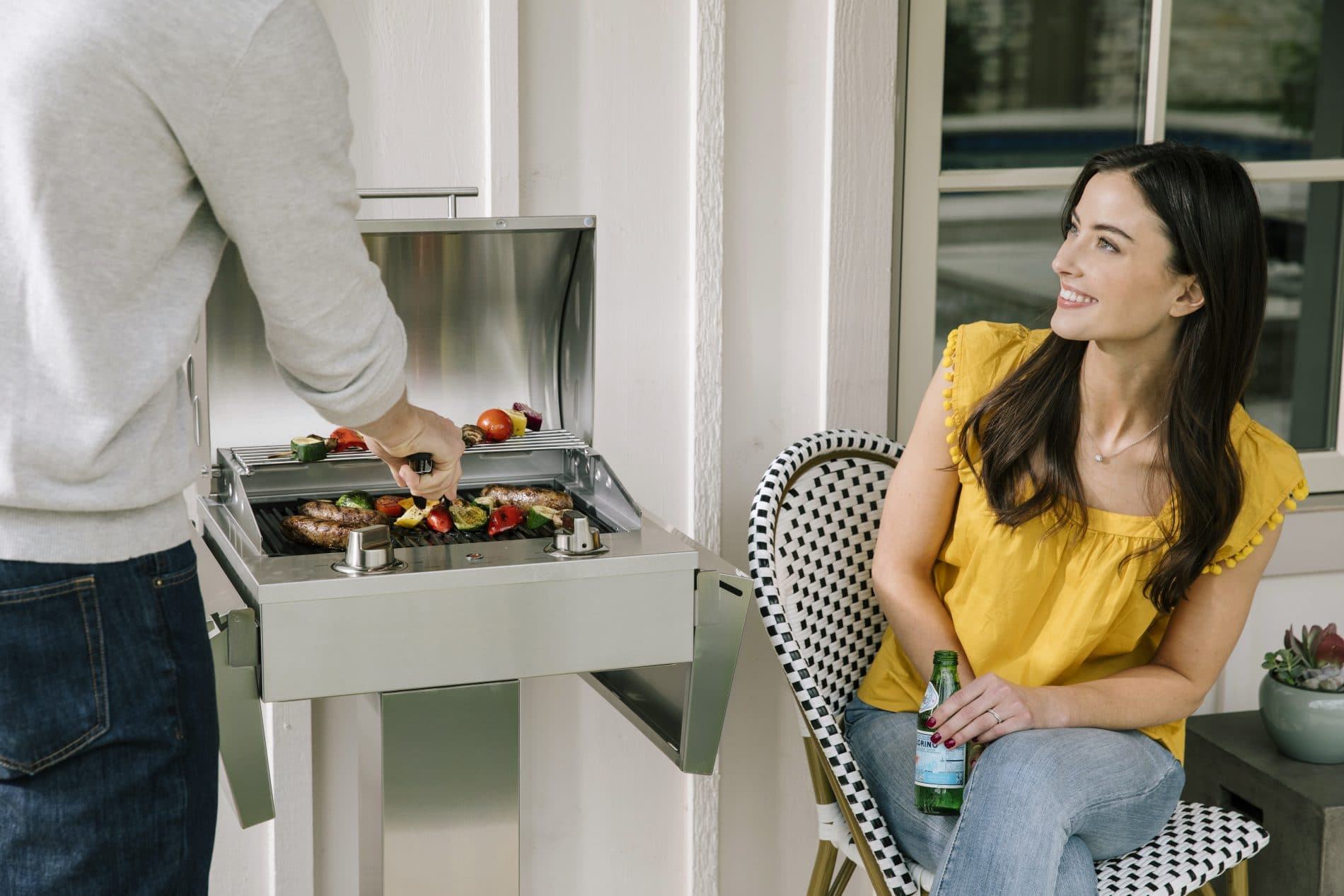 Couple Grilling on Coyote Electric Grill