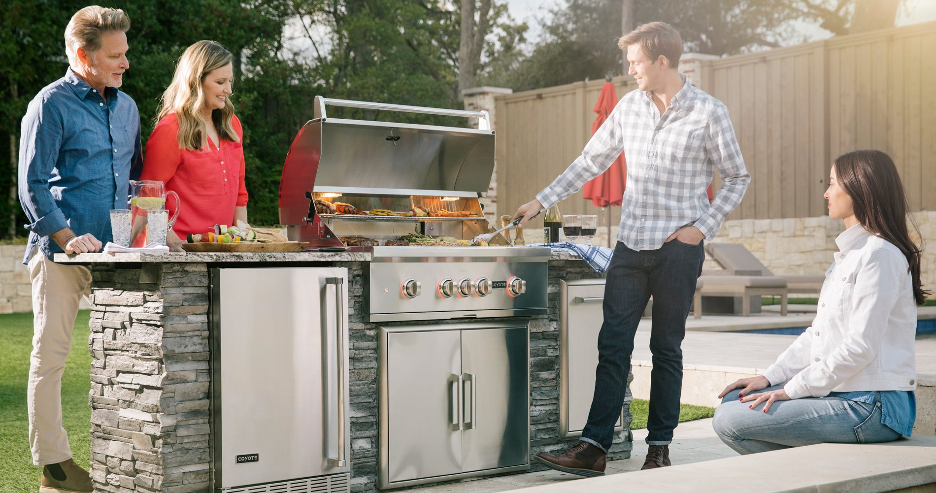 Two Couples Enjoying Coyote Outdoor Kitchen